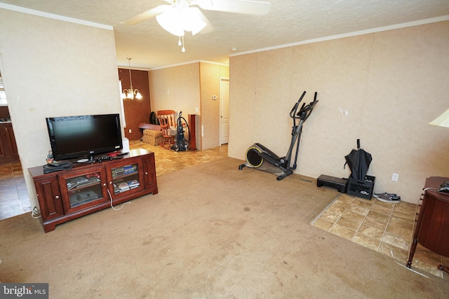 exercise room featuring a textured ceiling, ceiling fan with notable chandelier, ornamental molding, and carpet