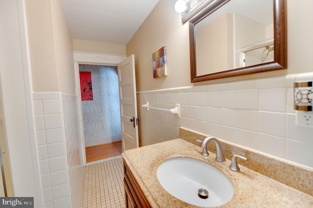 bathroom featuring tile walls and vanity