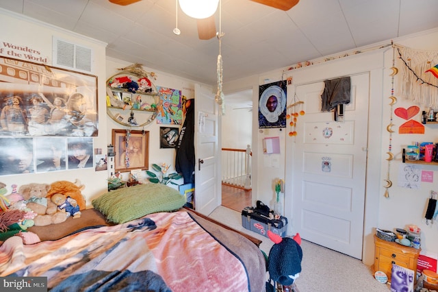 carpeted bedroom with ornamental molding