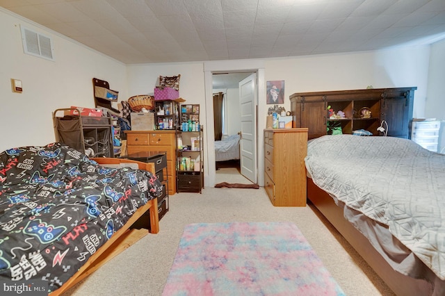 bedroom featuring light carpet