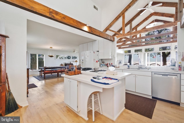 kitchen with hanging light fixtures, white fridge with ice dispenser, white cabinetry, and dishwasher