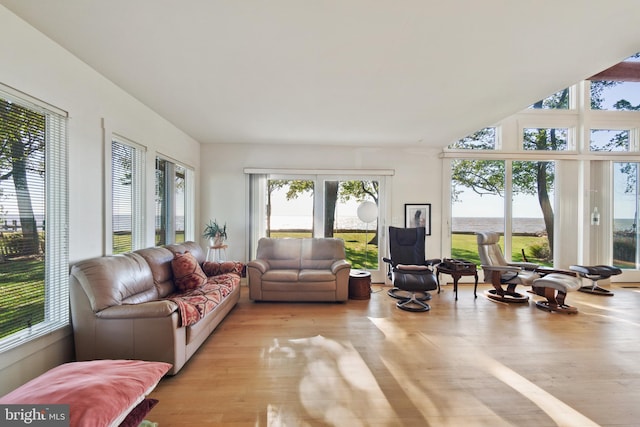 sunroom / solarium with a water view