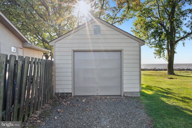 garage featuring a yard