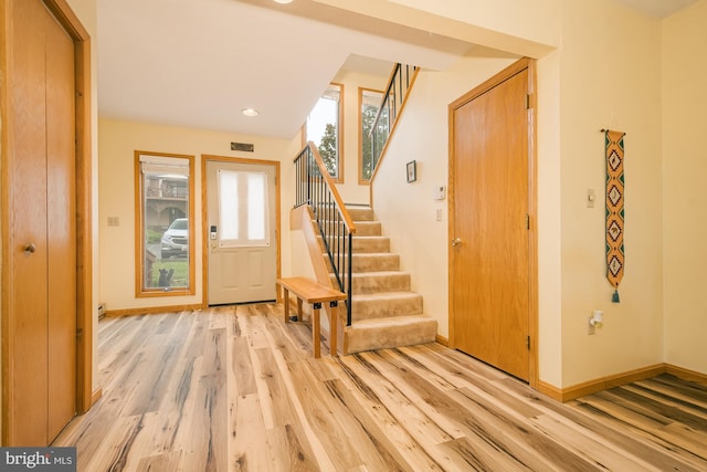 entrance foyer with light hardwood / wood-style floors