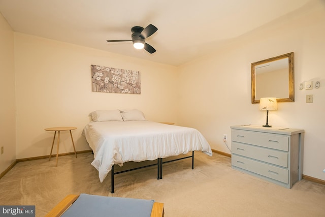 bedroom with light carpet and ceiling fan