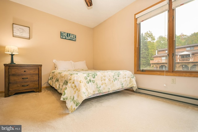 bedroom with carpet, lofted ceiling, baseboard heating, and ceiling fan