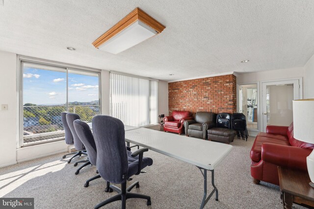 carpeted home office with a textured ceiling