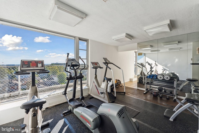 gym with a textured ceiling