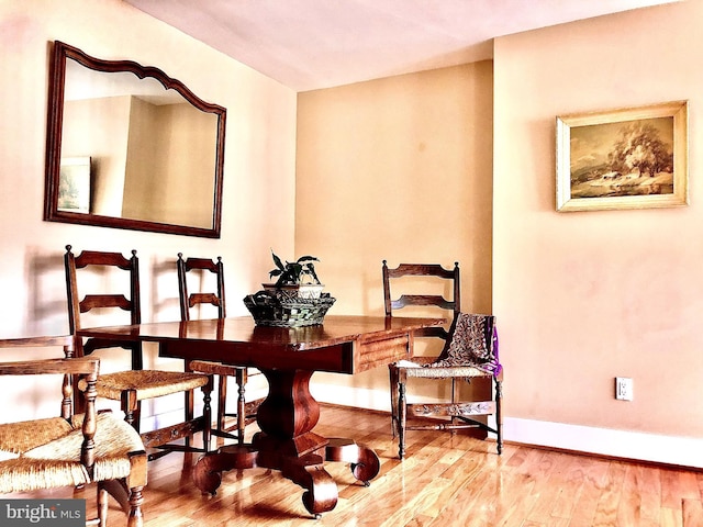 4840 Macarthur Blvd NW Unit 501, Washington, DC 20007 - dining room featuring baseboards and wood finished floors