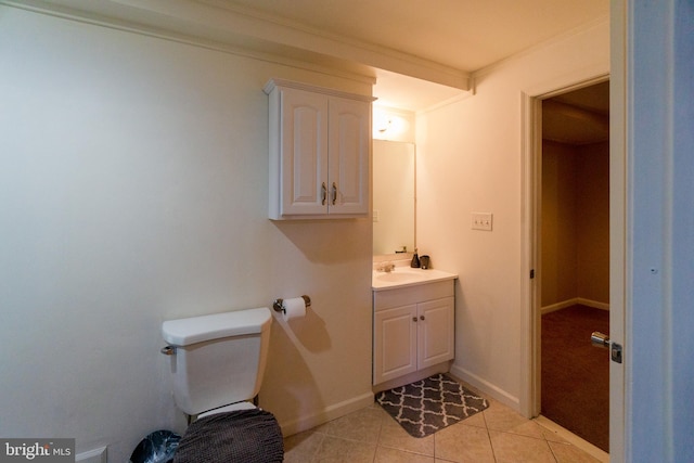 bathroom with vanity, crown molding, toilet, and tile patterned floors