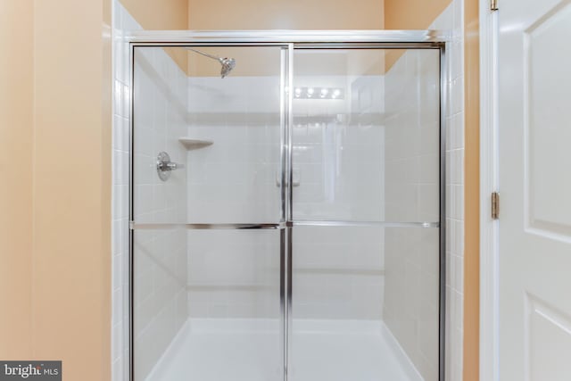 bathroom featuring an enclosed shower