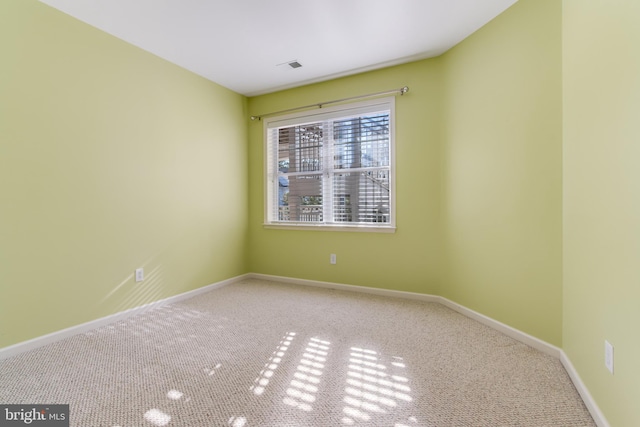 spare room with carpet floors