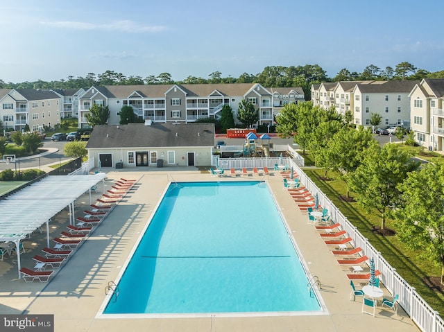 view of swimming pool featuring a patio area