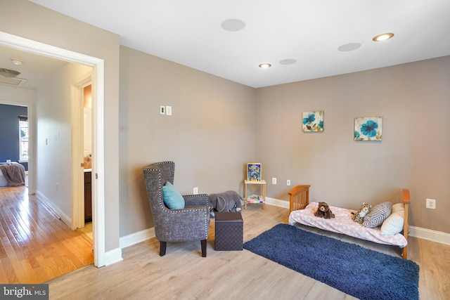 sitting room featuring light hardwood / wood-style floors