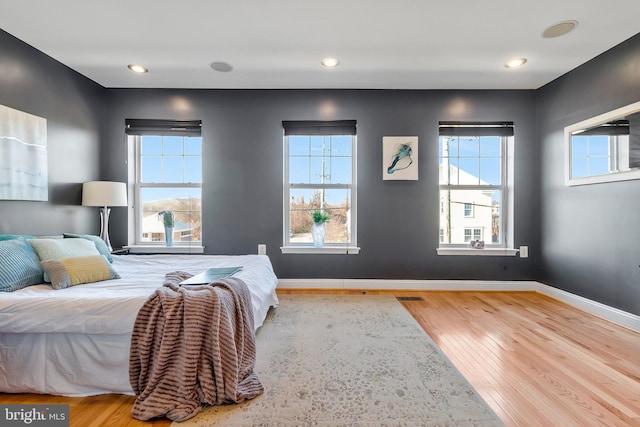 bedroom with hardwood / wood-style floors