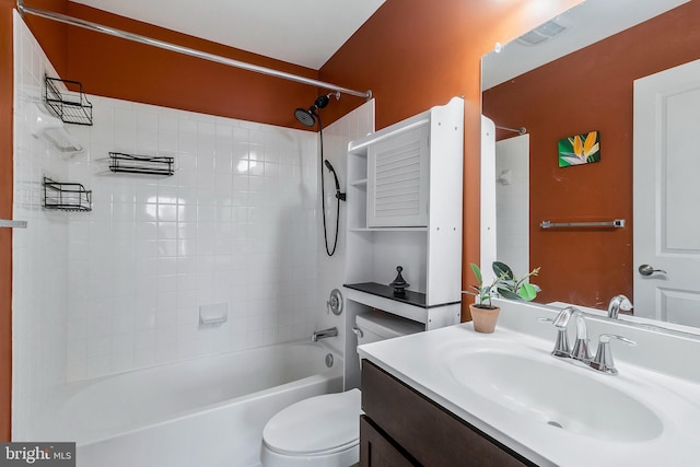 full bathroom featuring vanity, toilet, and tiled shower / bath combo