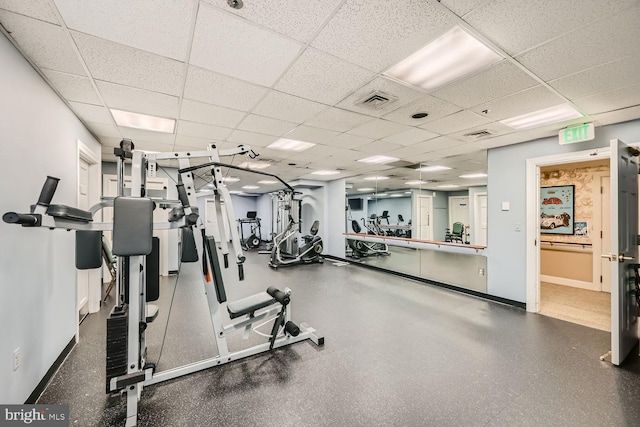 exercise room featuring a drop ceiling