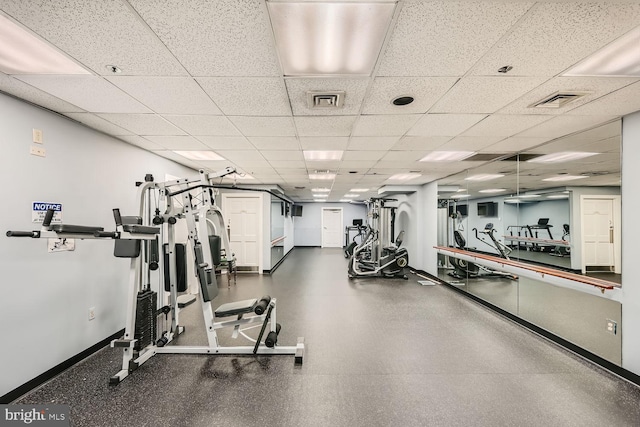 workout area featuring a paneled ceiling