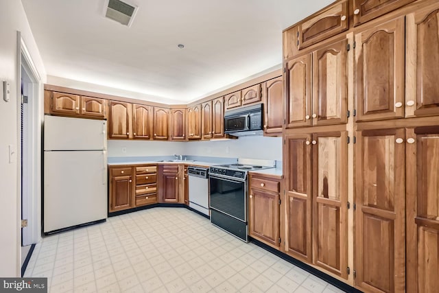 kitchen with sink and white appliances