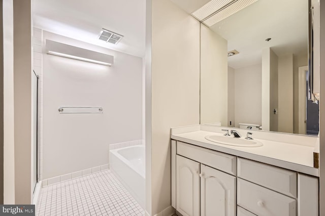 full bathroom featuring independent shower and bath, vanity, toilet, and tile patterned floors