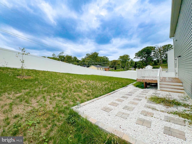 view of yard with a patio and a deck