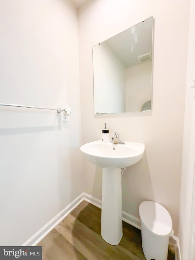 bathroom featuring hardwood / wood-style flooring