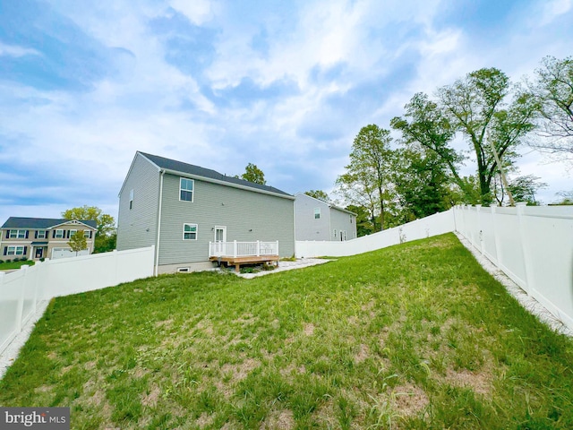 view of yard featuring a wooden deck