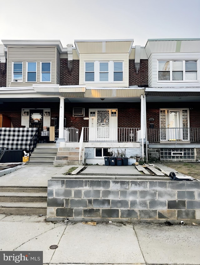 view of property with covered porch