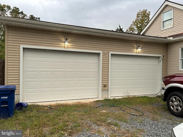 garage featuring wooden walls