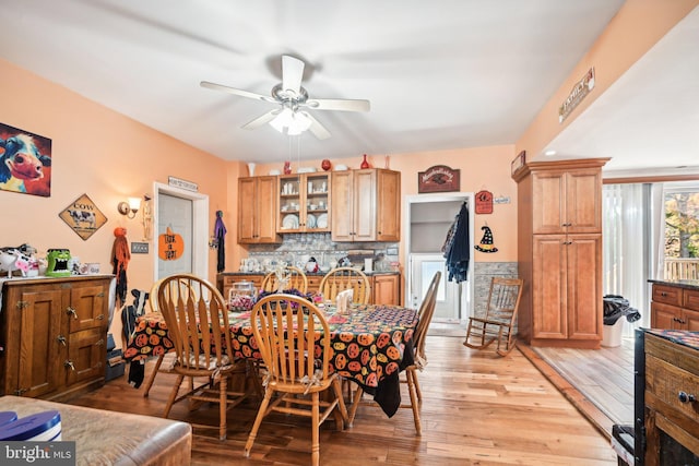 dining space featuring light wood-type flooring and ceiling fan