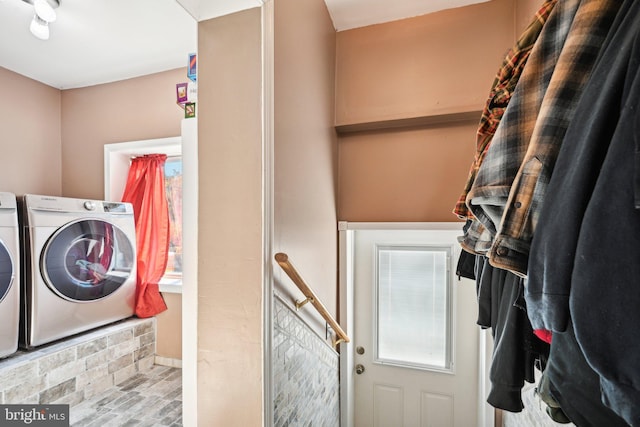 clothes washing area featuring washing machine and dryer