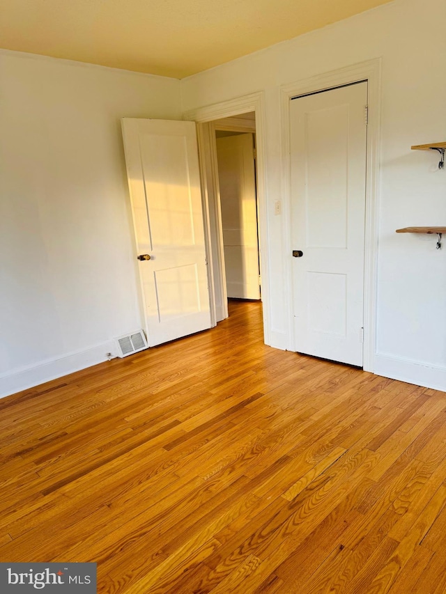 unfurnished bedroom with light hardwood / wood-style flooring