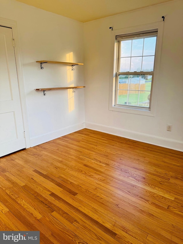 spare room with light wood-type flooring