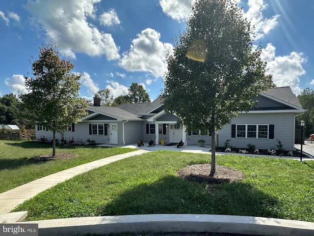 view of front of home with a front lawn