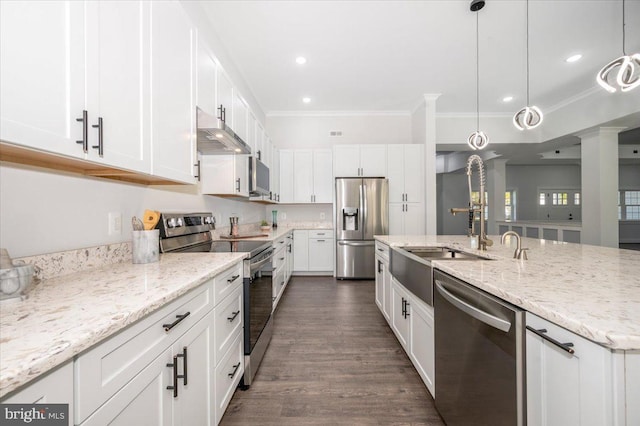 kitchen featuring pendant lighting, white cabinets, and appliances with stainless steel finishes