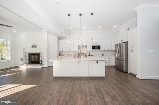 kitchen featuring white cabinetry, decorative light fixtures, stainless steel appliances, and dark hardwood / wood-style flooring