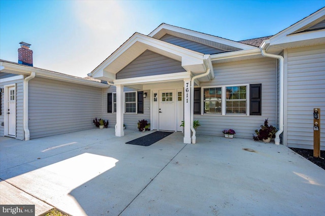 entrance to property featuring a patio area