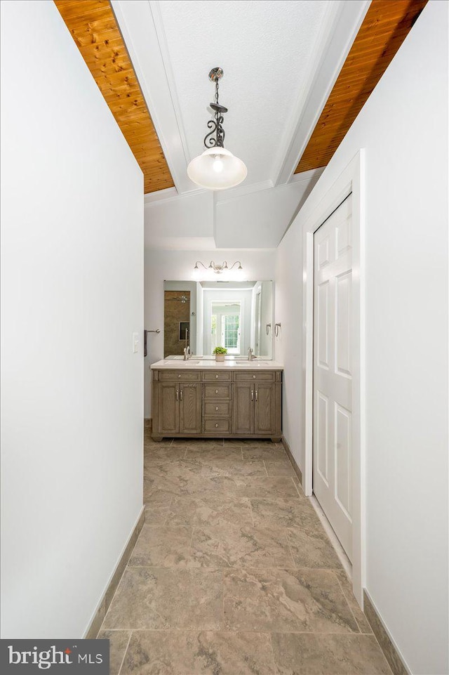 bathroom with lofted ceiling, vanity, and wooden ceiling