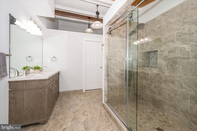 bathroom featuring an enclosed shower and vanity