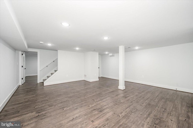 basement with dark wood-type flooring