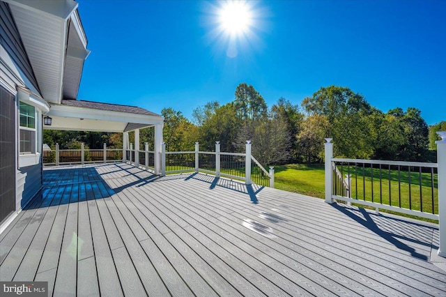 wooden deck with a yard