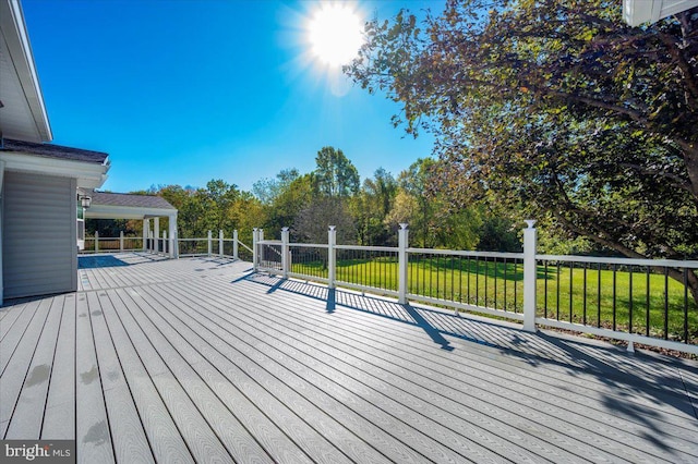 wooden deck with a yard