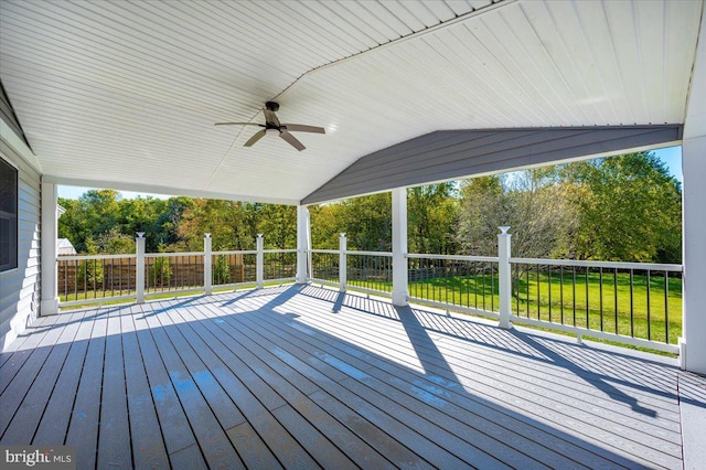 wooden deck with a yard and ceiling fan