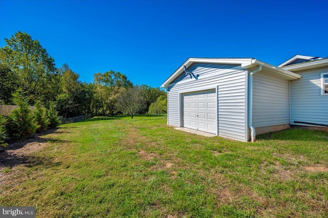 garage featuring a yard