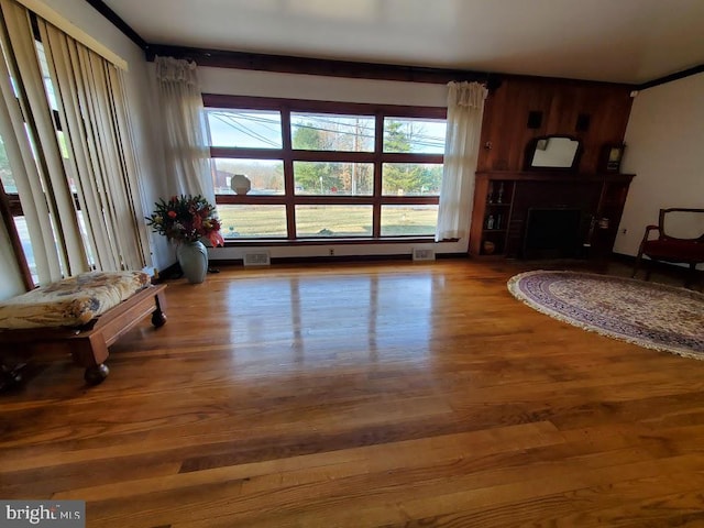 sitting room with hardwood / wood-style flooring