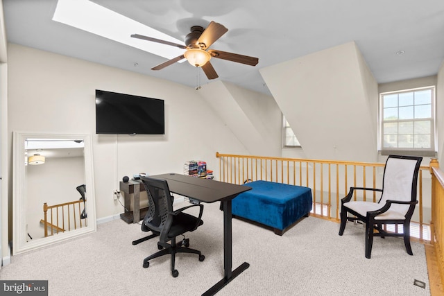 carpeted office space featuring ceiling fan