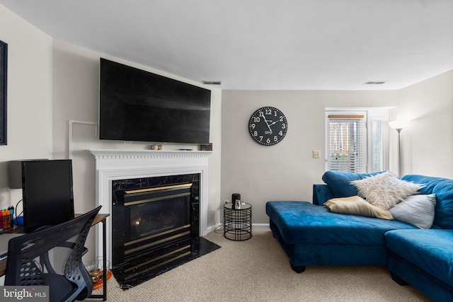 carpeted living room with a fireplace