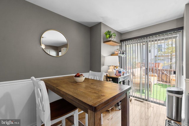 dining space featuring light wood-type flooring