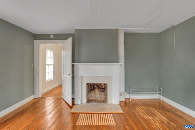 unfurnished living room with hardwood / wood-style flooring