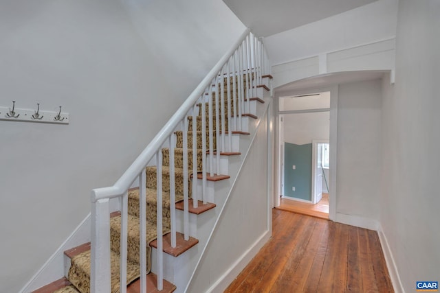 stairway featuring hardwood / wood-style flooring